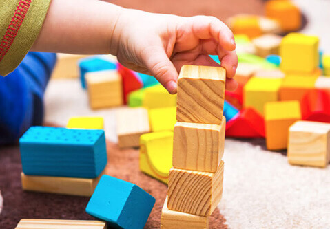 Child building with blocks