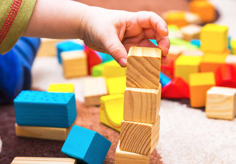 Child building with blocks