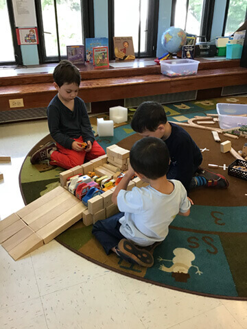 Children building with blocks in pre-k school